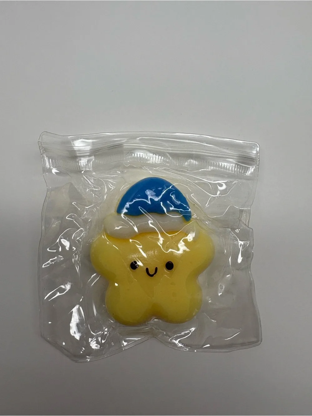 Yellow Star Squishy Squeeze Toy with Blue Cap  Yellow Blue